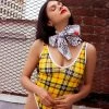 The Sugarpuss Collection Modern Plaids Plaid High Cut V-Neck Bodysuit In Yellow